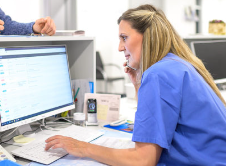 HRC Frankfurt coordinator reviewing patient records at the international patient desk